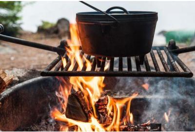 8-quart Dutch oven cooking over an open fire