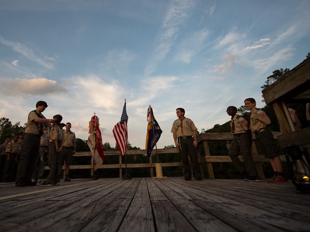 Webelos Scout transitions to Scouts BSA at a Crossover Ceremony