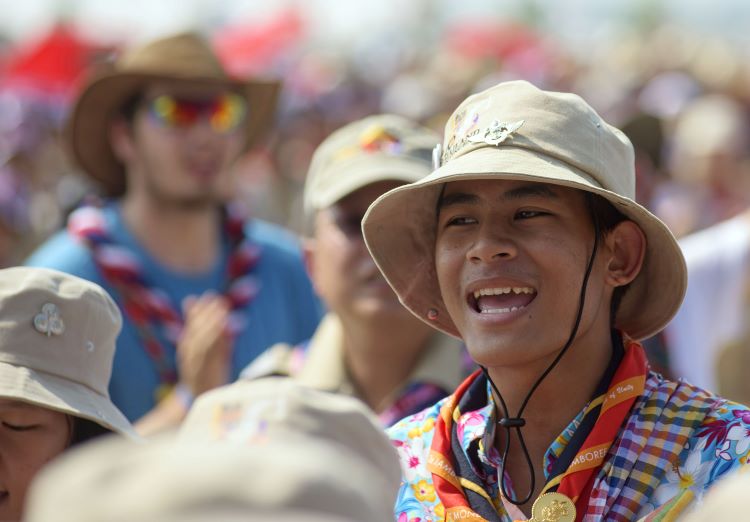 Scout smiles in a crowd at the World Jamboree