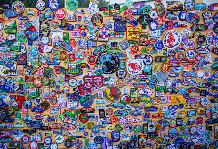 A wall of Scouting America patches from around the U.S. and world at the Scout Jamboree