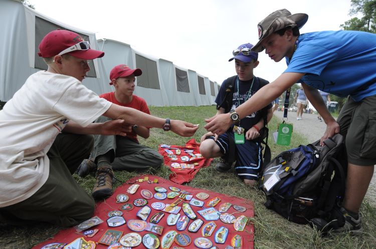 Four Scouting America trade patches at the National Scout Jamboree