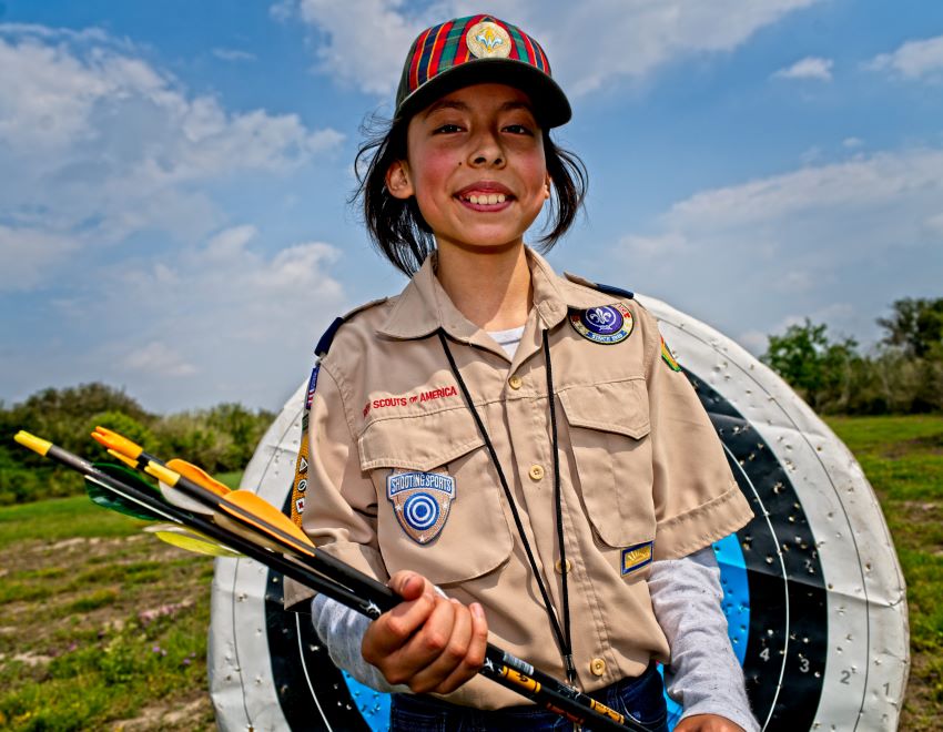 A young female Scout in the Scouts BSA uniform