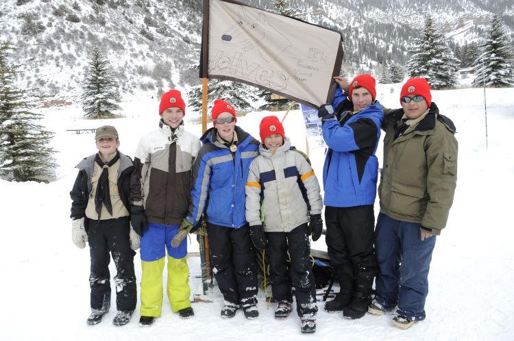 Scouts Winter Camping Scouts from a pack pose for a picture in winter camping gear