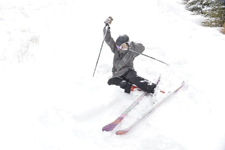 Scouts skiing on a snowy slope